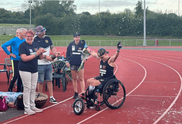 Lexi celebrating on a track